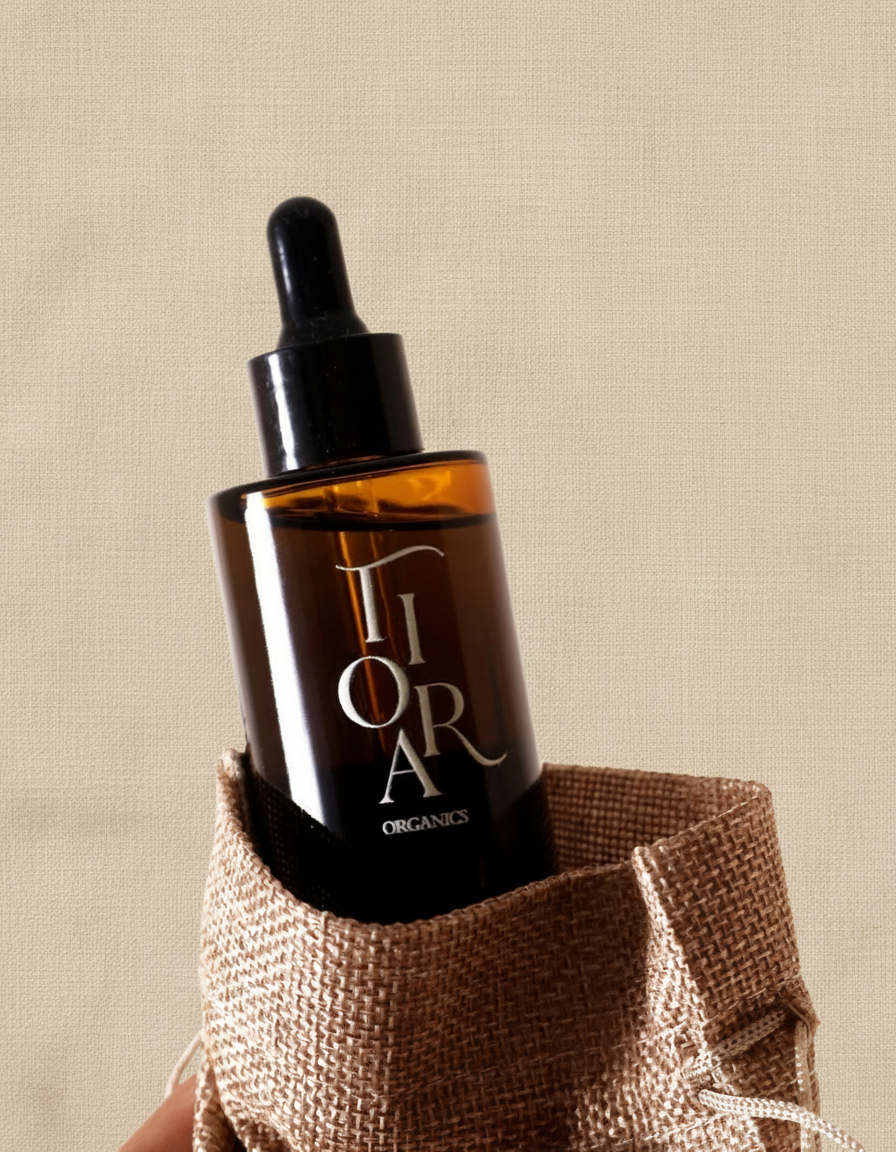 Tiora Organics dropper bottle with linen cloth background